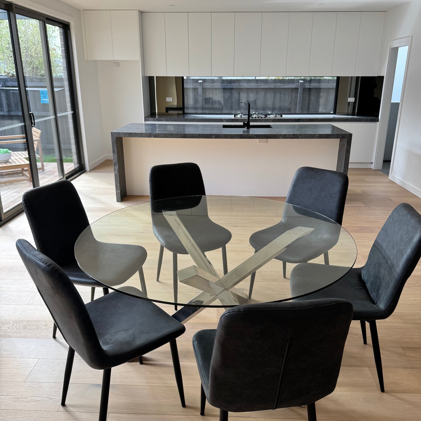 NIck Scali Glass Dining Table with 6 Freedom Leather Chairs